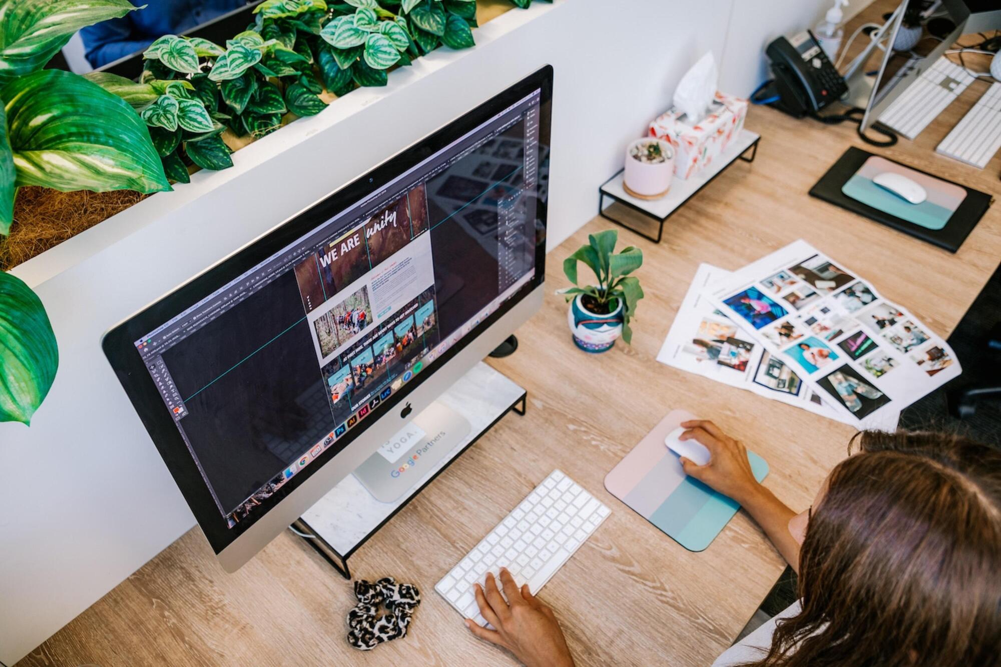 Image of female searching PC for ideal web development company in Florida.